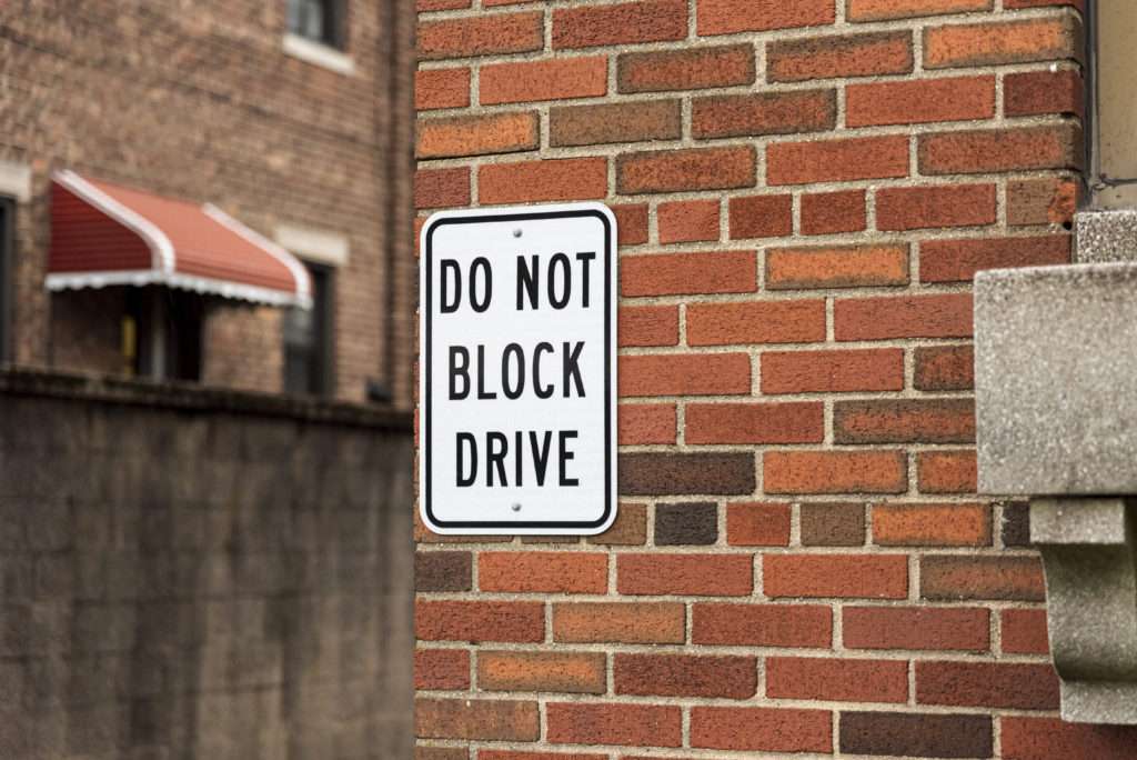 block-sign-brick-wall