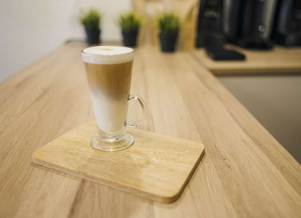 high-angle-coffee-beverage-served-wooden-plate